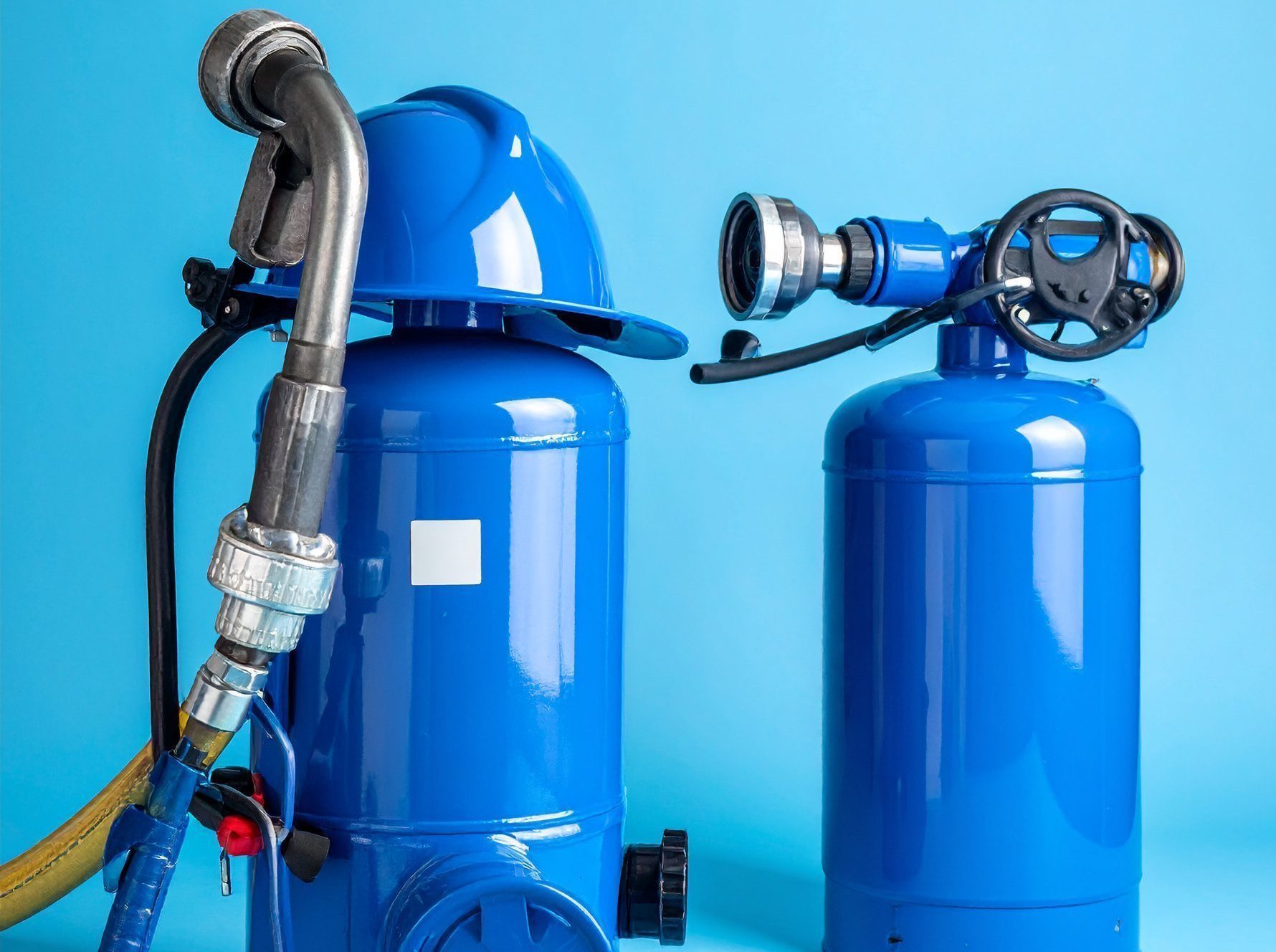 Blue fire fighting equipment, blue background 954047